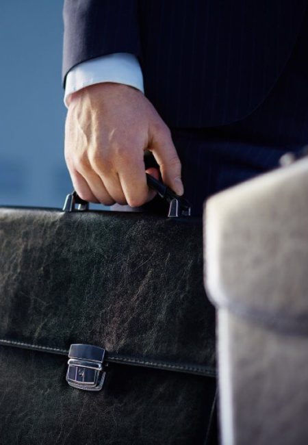 close-up-workers-with-briefcases